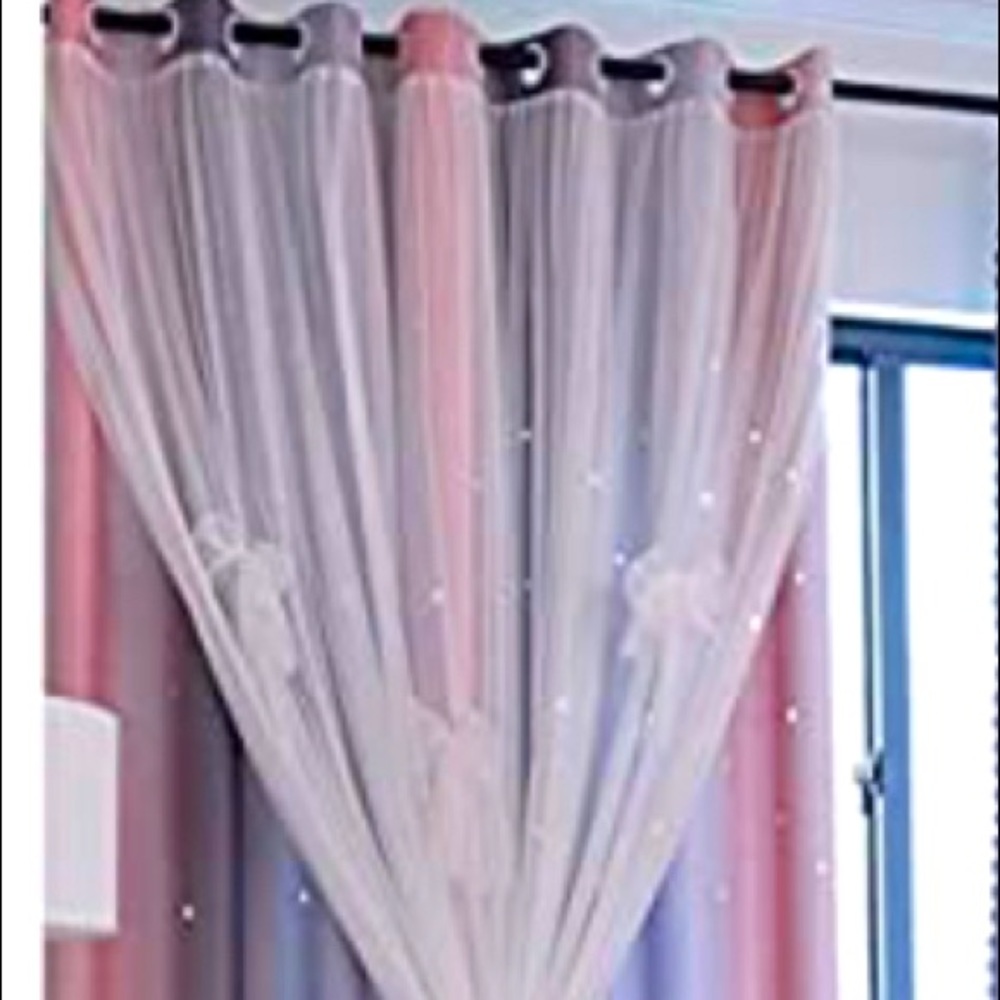 Room darkening curtains with star cutouts